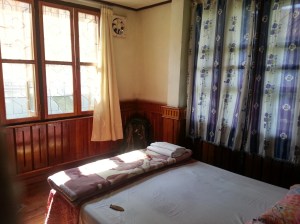 A cheap, but very nice, wooden guesthouse room in Laos